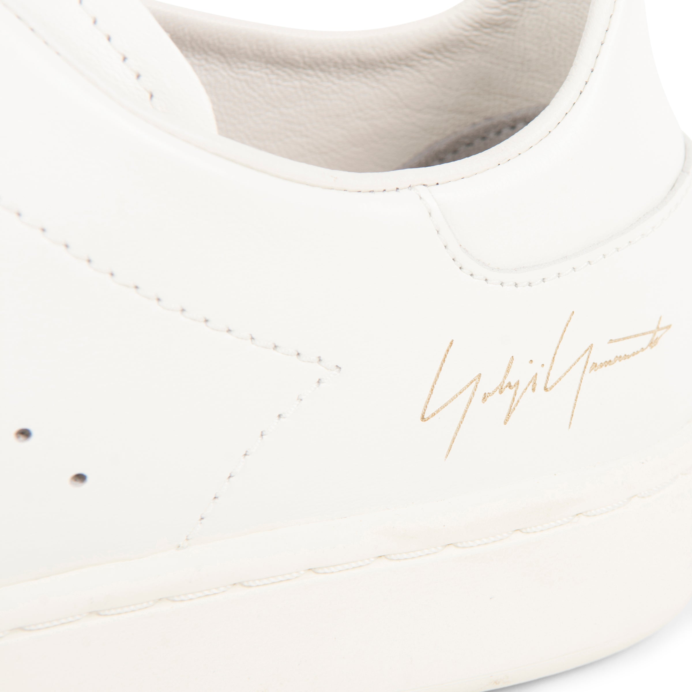 Y-3 off white Stan Smith trainers with minimalist leather upper, perforated detailing and clean low-top silhouette