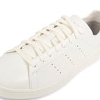 Y-3 off white Stan Smith trainers with minimalist leather upper, perforated detailing and clean low-top silhouette