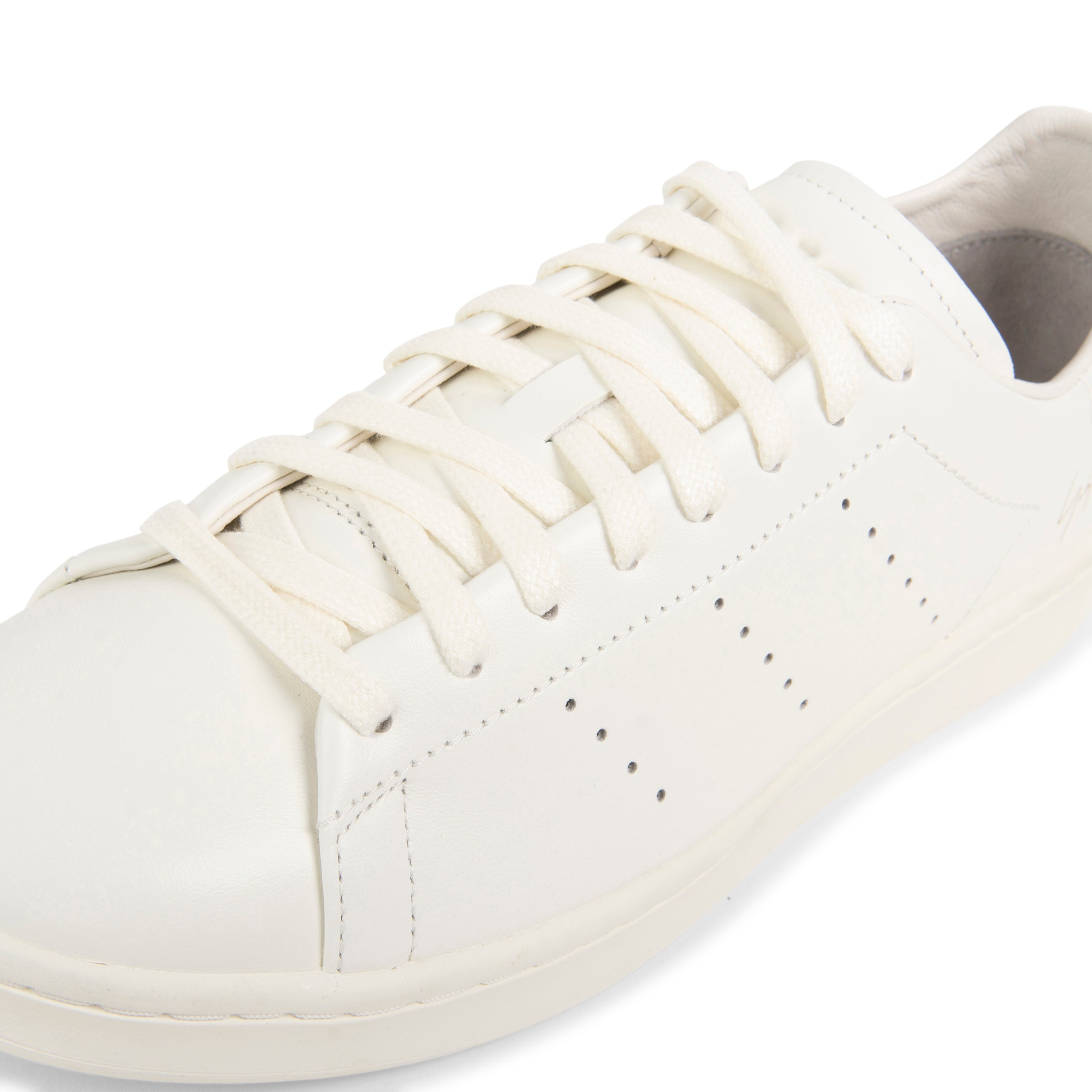 Y-3 off white Stan Smith trainers with minimalist leather upper, perforated detailing and clean low-top silhouette